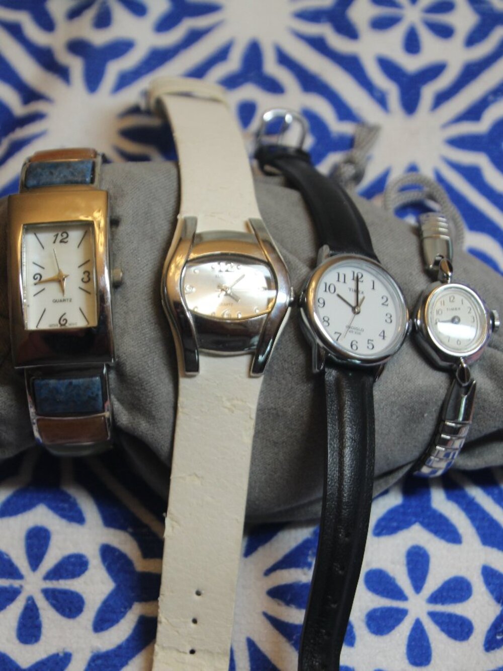 Four silver tone watches for one price. All used. See description below.